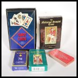 A collection of five sets of Tarot cards to include a boxed Medieval Scampini, another set with