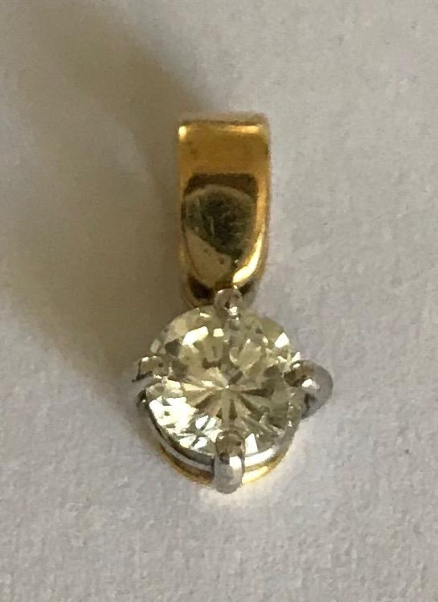 A 20th Century diamond pendant having a hallmarked 18ct gold bale set with a brilliant cut diamond