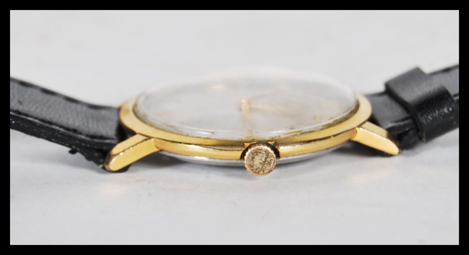 A vintage 20th Century gilt cased Omega mechanical wrist watch, gilt baton markers with a mother - Image 5 of 7