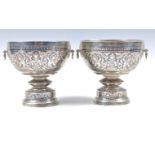 A PAIR OF EARLY 20TH CENTURY THAI SILVER WINE GOBL