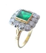 AN 18CT GOLD EMERALD AND DIAMOND LADIES RING