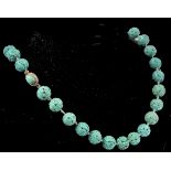 An early 20th century French carved turquoise colo