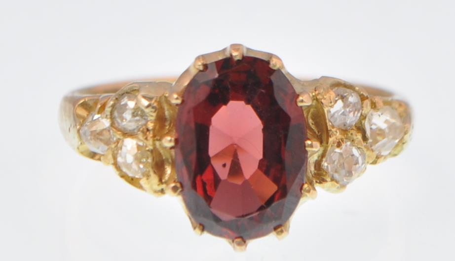 18CT GOLD ALMONDINE GARNET AND DIAMOND RING