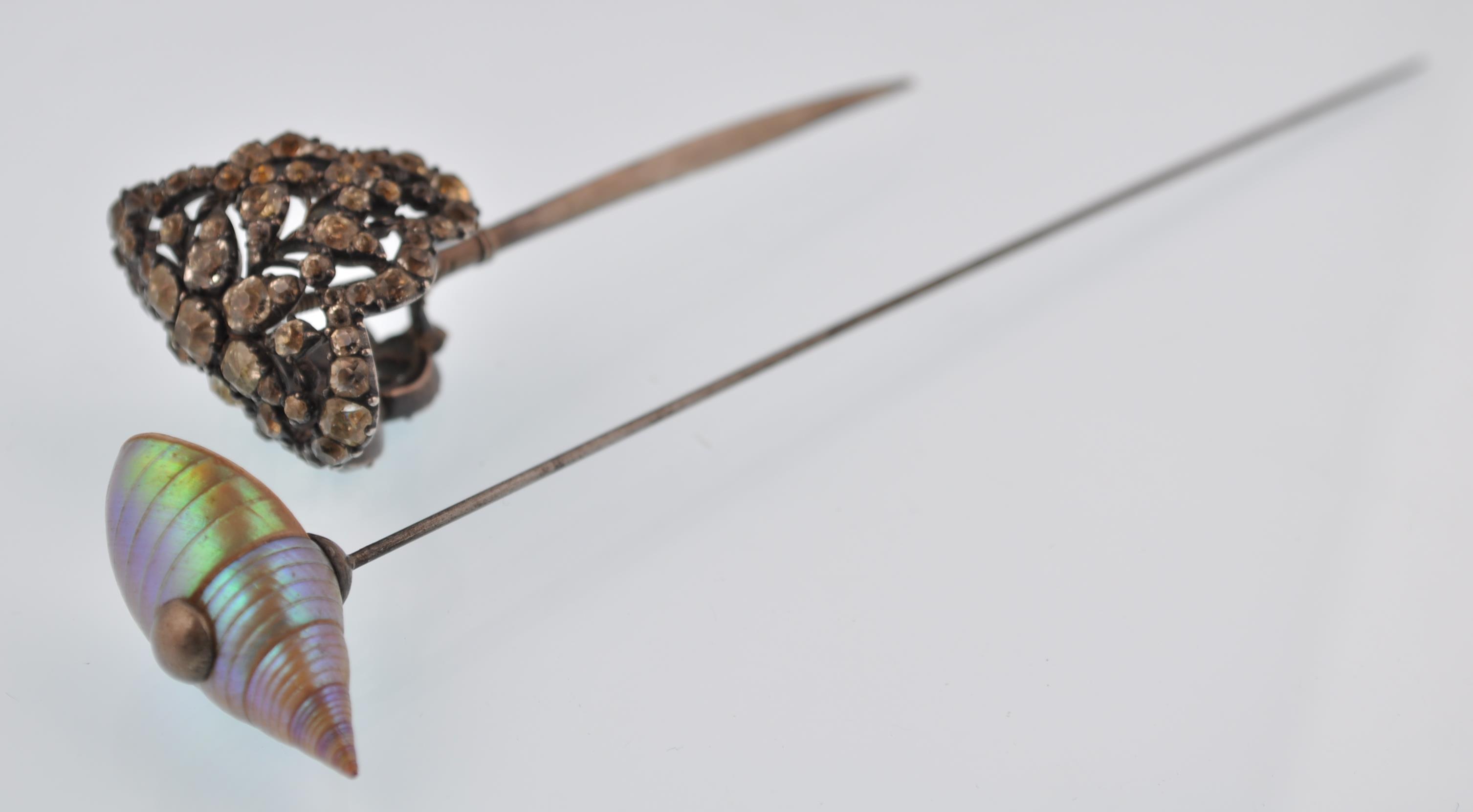 An early 20th century hat pin and hair stick pin. - Image 2 of 6