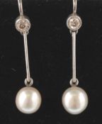 A pair of white gold, diamond and pearl earrings.