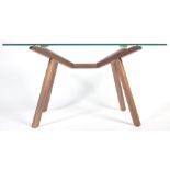 A CONTEMPORARY WALNUT AND GLASS DINING TABLE BY SEAN DIX