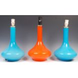 GROUP OF THREE HOLMEGAARD CASED ORANGE GLASS LAMPS.