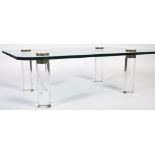 LARGE GLASS LUCITE AND BRONZE OCCASIONAL TABLE BY KARL SPRINGER.