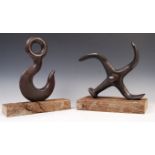 PAIR OF CAST METAL NAUTICAL THEMED DOOR STOPS.