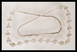 A 20th Century ethnic style silver necklace having