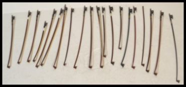 A collection of 20th Century violin bows, most bow