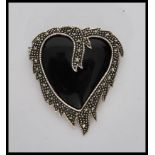 A stamped 925 silver heart shaped brooch having on