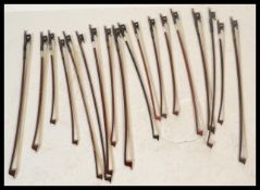 A collection of 20th Century violin bows, most bow