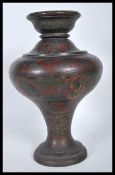 A 19th Century Indian brass vase having engraved a