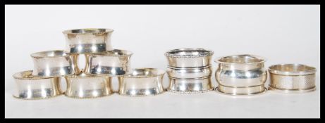 A collection of silver napkin rings to include an