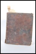 An 18th Century Welsh bible being leather bound in