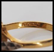 A hallmarked 18ct gold ladies dress ring set with