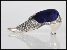 A sterling silver Victorian style pincushion in th
