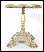 A Victorian 19th Century brass trivet stand, havin