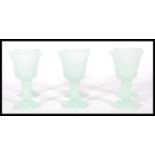 A set of six 20th Century green jadeite goblets of
