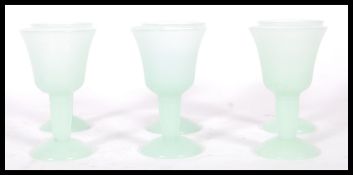 A set of six 20th Century green jadeite goblets of