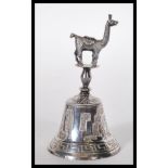A stamped 925 silver bell having engraved South Am