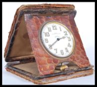 A vintage early 20th Century travelling desk clock