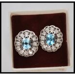 A pair of ladies silver dress earrings prong set w