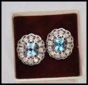A pair of ladies silver dress earrings prong set w