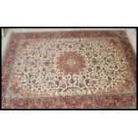 A large Persian floor carpet Keshan rug having a b