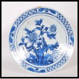 A 19th Century blue and white charger plate, depic