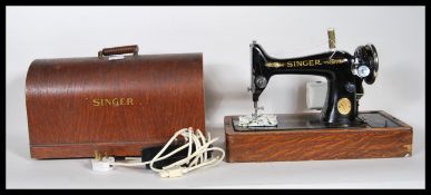 A 20th Century vintage cased Singer sewing machine