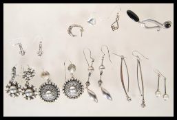 A selection of silver earrings to include a pair o