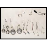 A selection of silver earrings to include a pair o