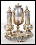 An early 20th Century silver plated oil burner con