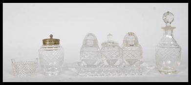 A collection of 20th Century cut glass cruets to i