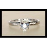 A hallmarked 9ct white gold ladies ring prong set