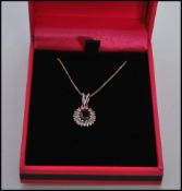 A stamped 750 18ct white gold pendant necklace hav