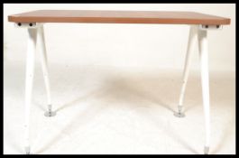 A 20th century desk, walnut top raised on angular