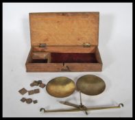 A set of vintage postage scales set within a woode