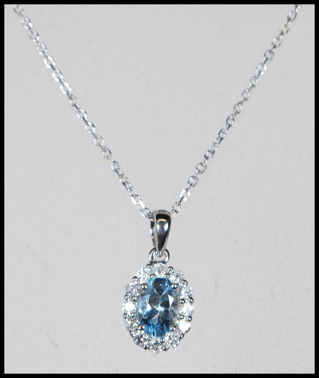An 18ct white gold, aquamarine and diamond set necklace pendant set to a gold back chai. The central - Image 3 of 5