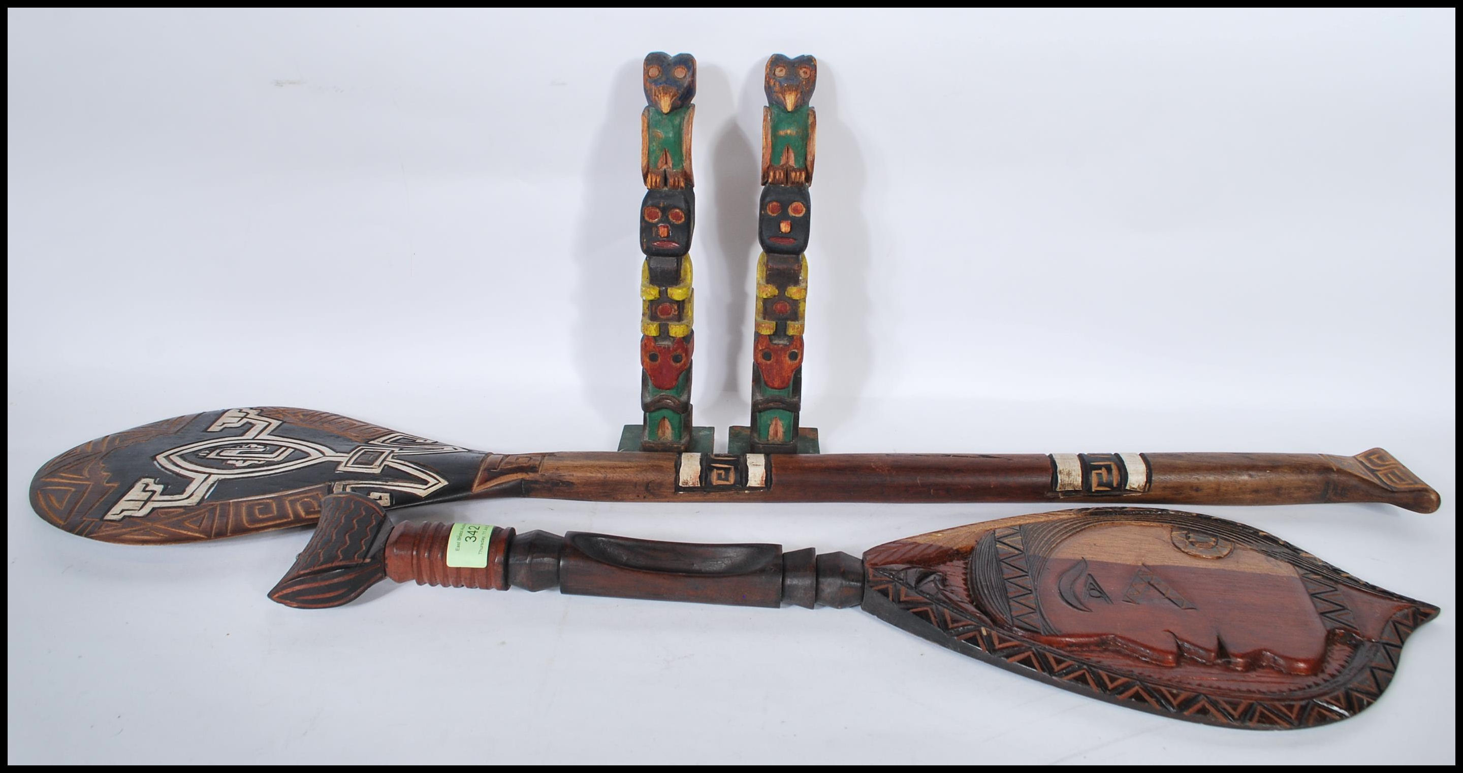 A collection of 20th Century possibly Polynesian ceremonial tribal items to include two non matching