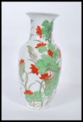 A early 20th Chinese porcelain vase being of tapering form and flared top, having white ground