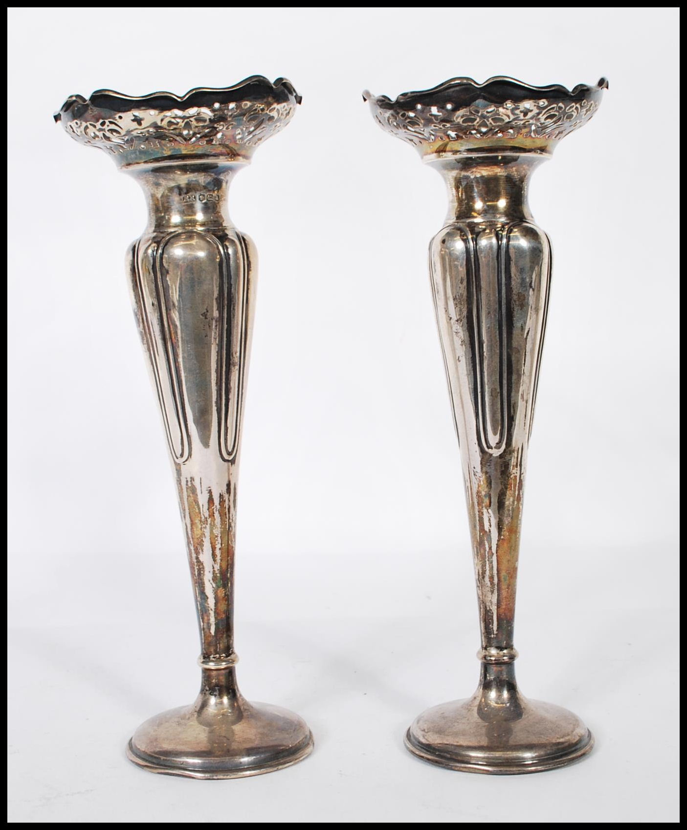 A pair of early 20th Century Art nouveau silver hallmarked spill vases of tapering form having