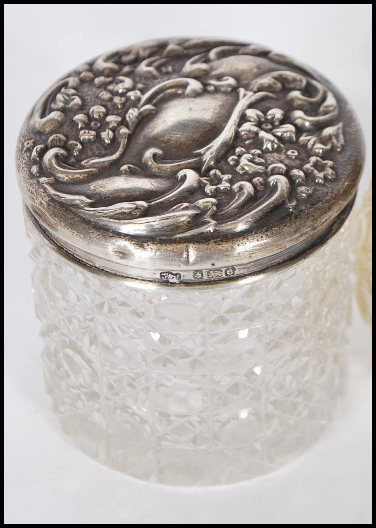 A group of early 20th Century silver topped and cut glass bodied dressing table pots, most having - Image 6 of 11