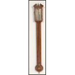 A 19th Century Georgian oak stick barometer. The silvered dial marked for J Powell Worcester. Having