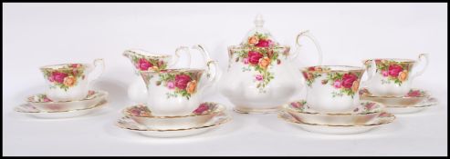 A Royal Albert bone China tea service in the ' Old Country Roses ' pattern consisting of teapot,