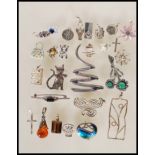 A selection of silver jewellery to include pendant and brooches, most being stamped 925 or marks
