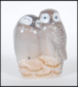 A 20th Century ceramic figure of a pair of owls by Royal Copenhagen Denmark no. 834 marks to