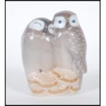 A 20th Century ceramic figure of a pair of owls by Royal Copenhagen Denmark no. 834 marks to